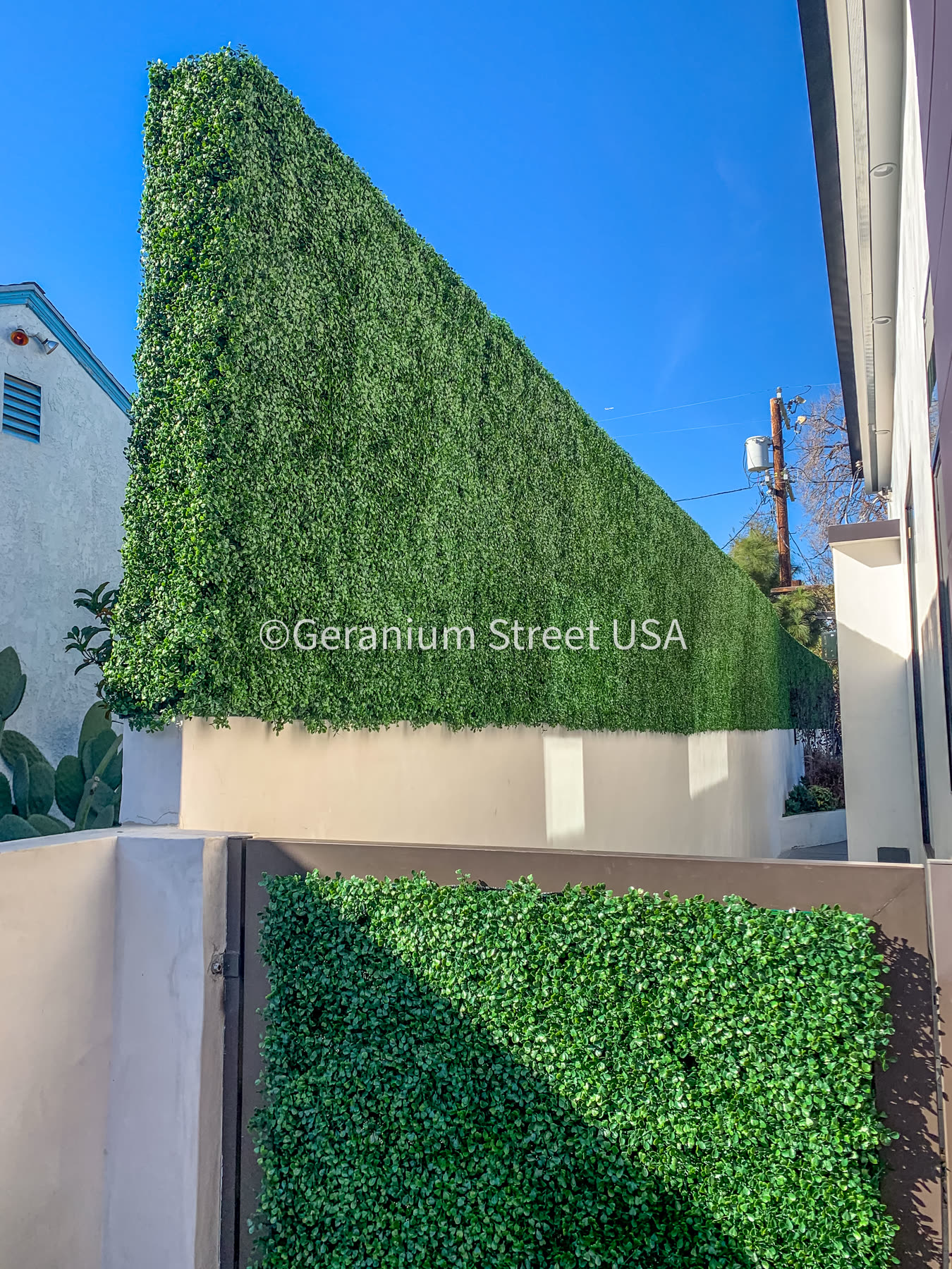 Custom artificial hedge panels on fence